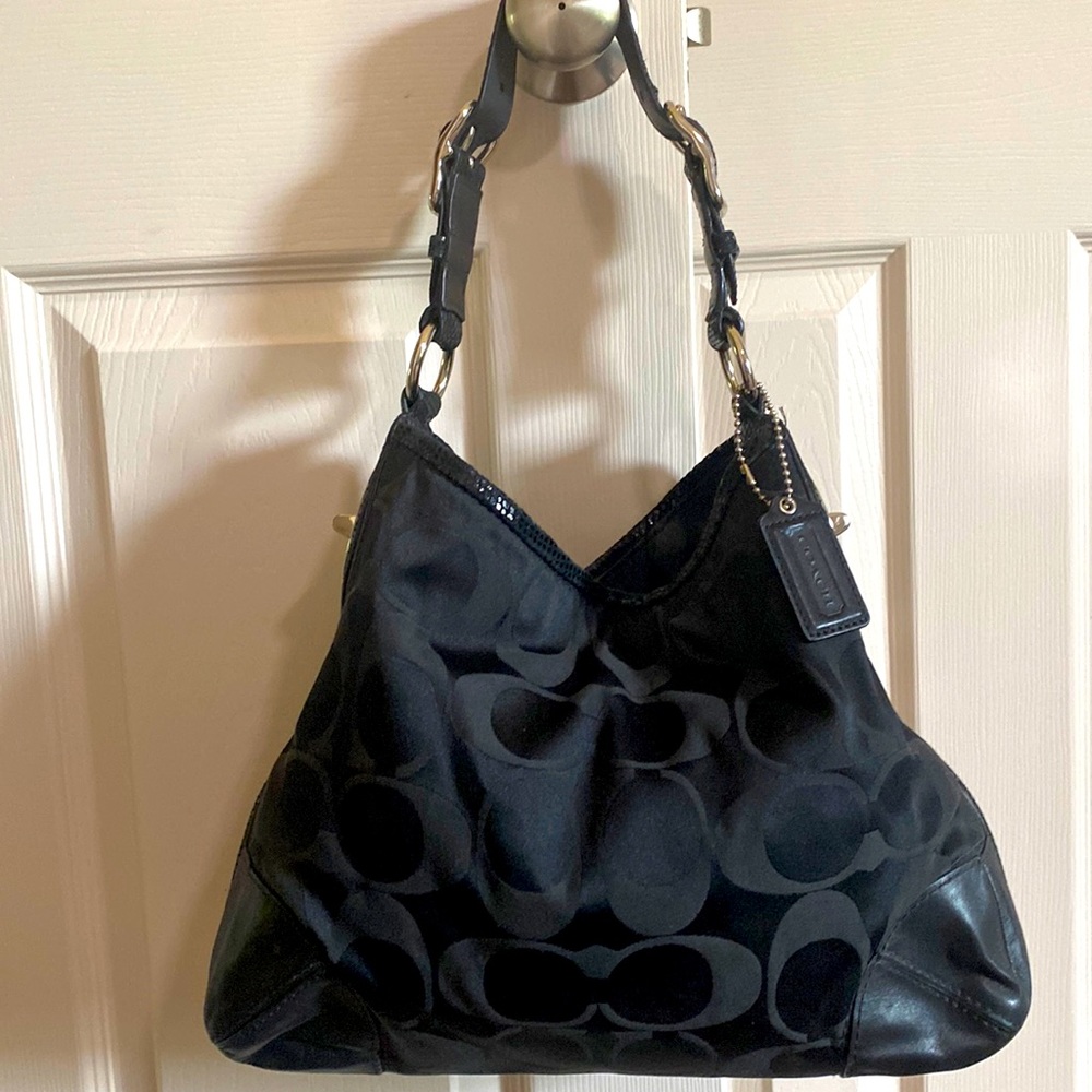 Black Coach tote bag purse.